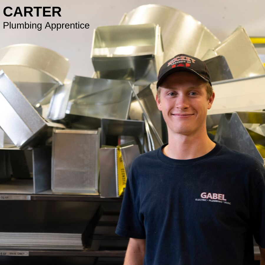 Young man standing in from of metal blocks