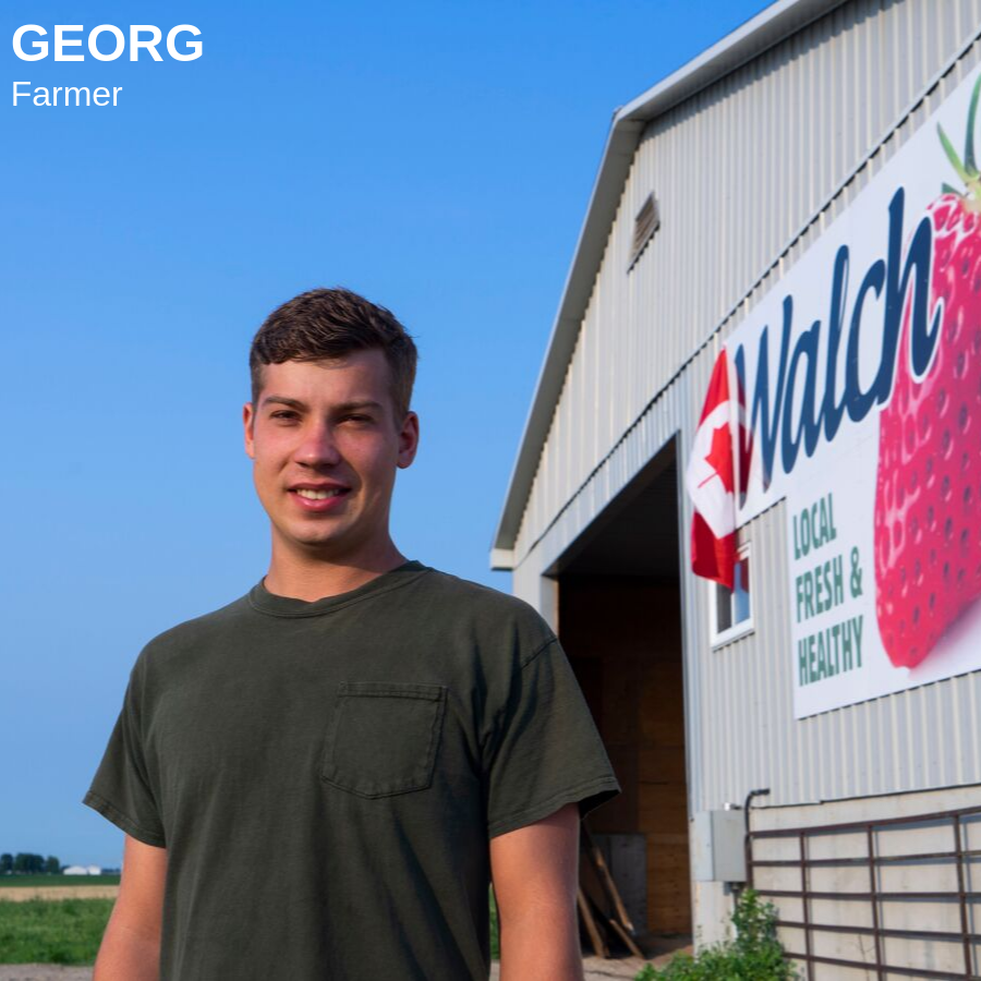 Man standing in front of a barn