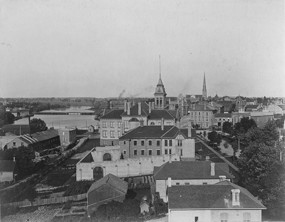 Black and white image of the County Courthouse from down the street, ca. 1890